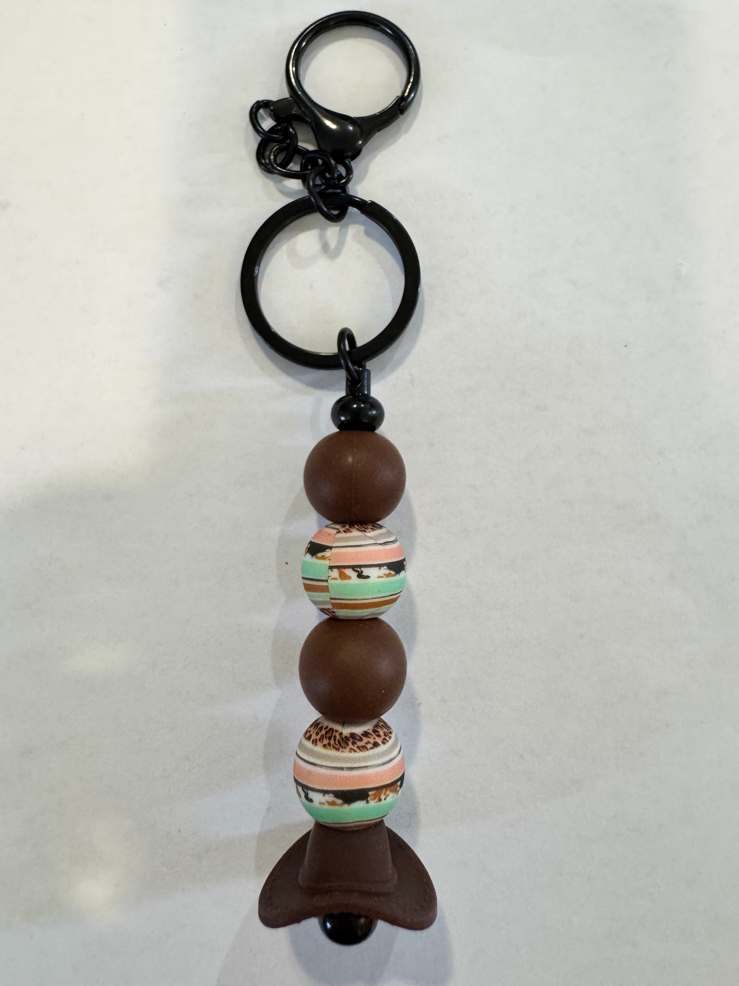 Keychain with beads and a bow on a white background