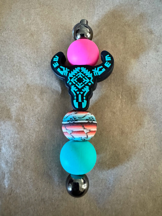 Dust'd Up longhorn keyrings in teal and pink